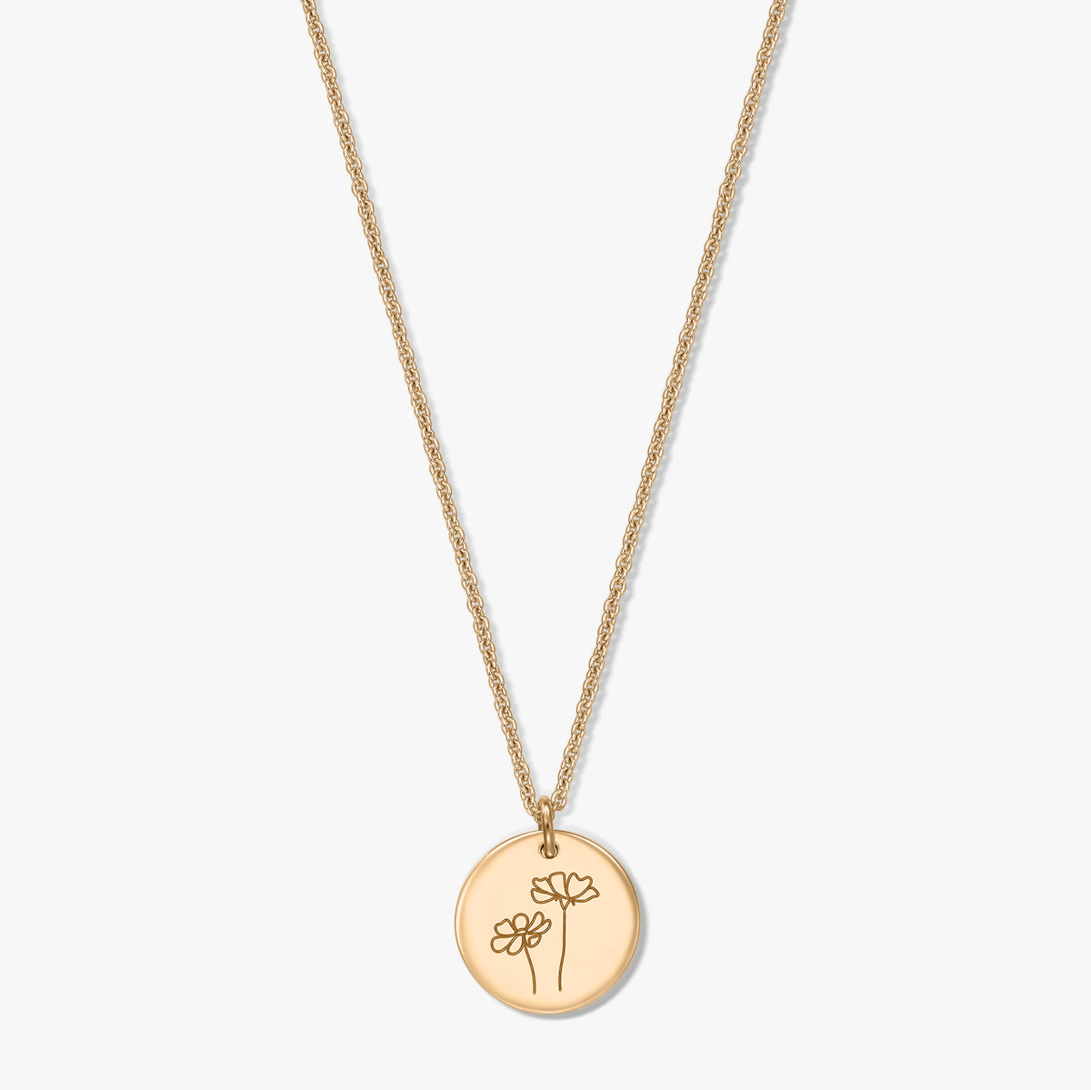 Gold-plated silver necklace featuring a round disc pendant engraved with two cosmos flowers, set against a white background.