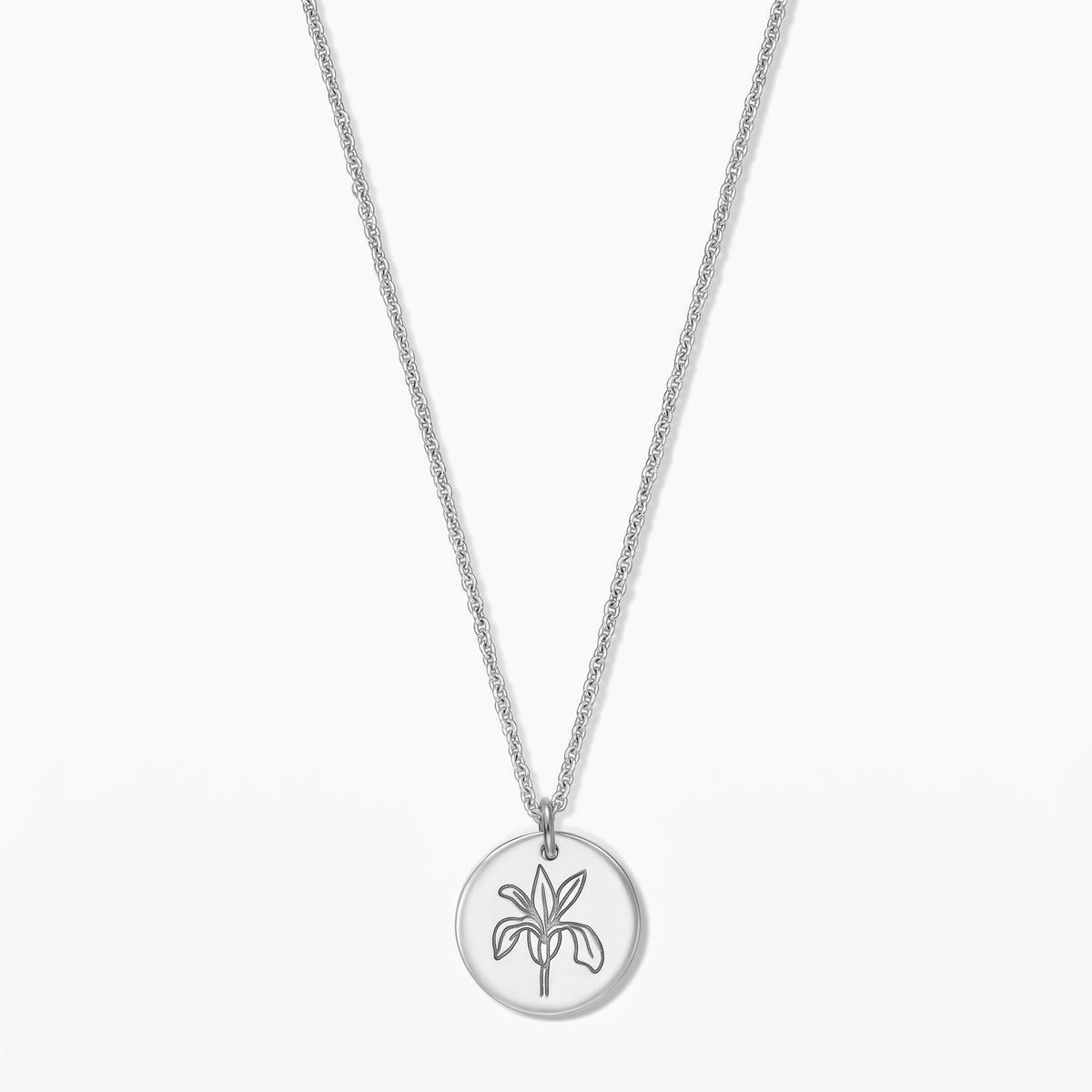 Elegant sterling silver necklace with a round pendant featuring an iris line-art motif on a white background.