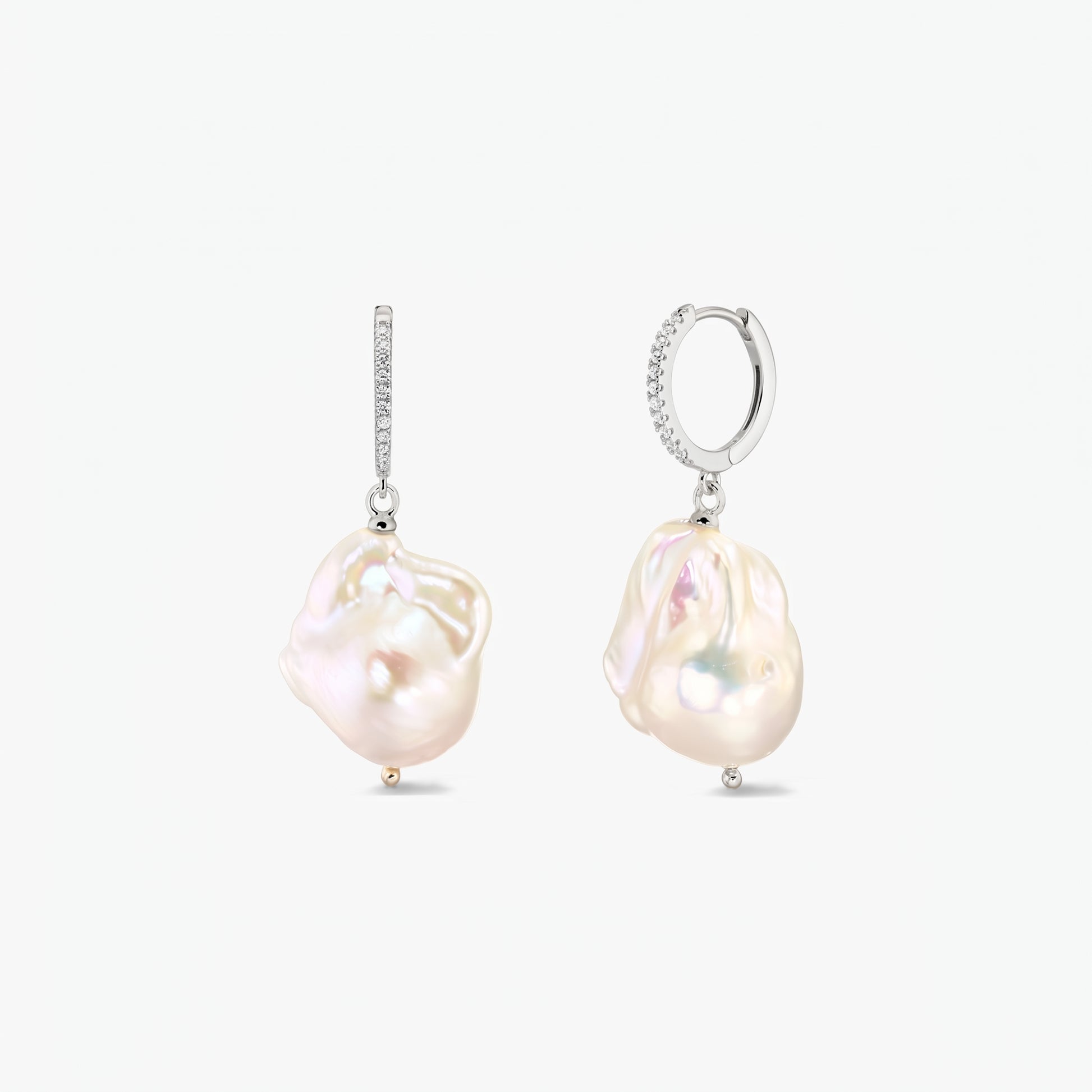 Elegant rhodium‑plated 925 silver hoop earrings with pavé zirconia and large organic baroque pearls on a white background.