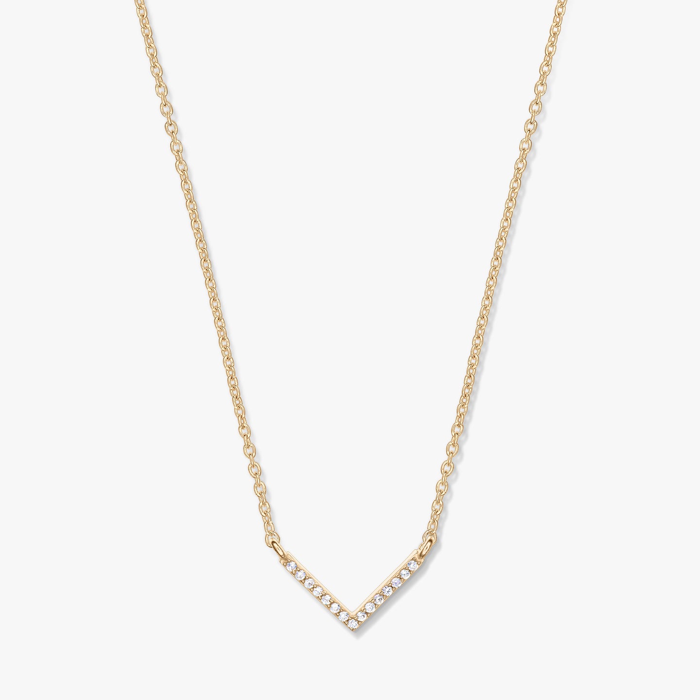 Golden V-shaped zirconia pendant necklace on a delicate chain, photographed on a white background.