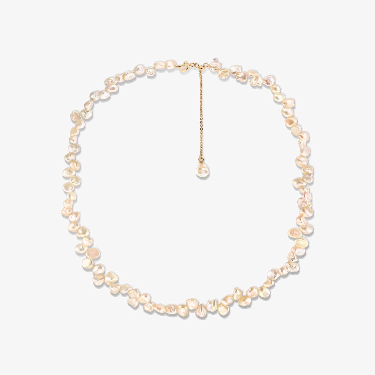 Gold-plated silver necklace featuring irregular pink keshi freshwater pearls and an adjustable chain extender, photographed on a white background.