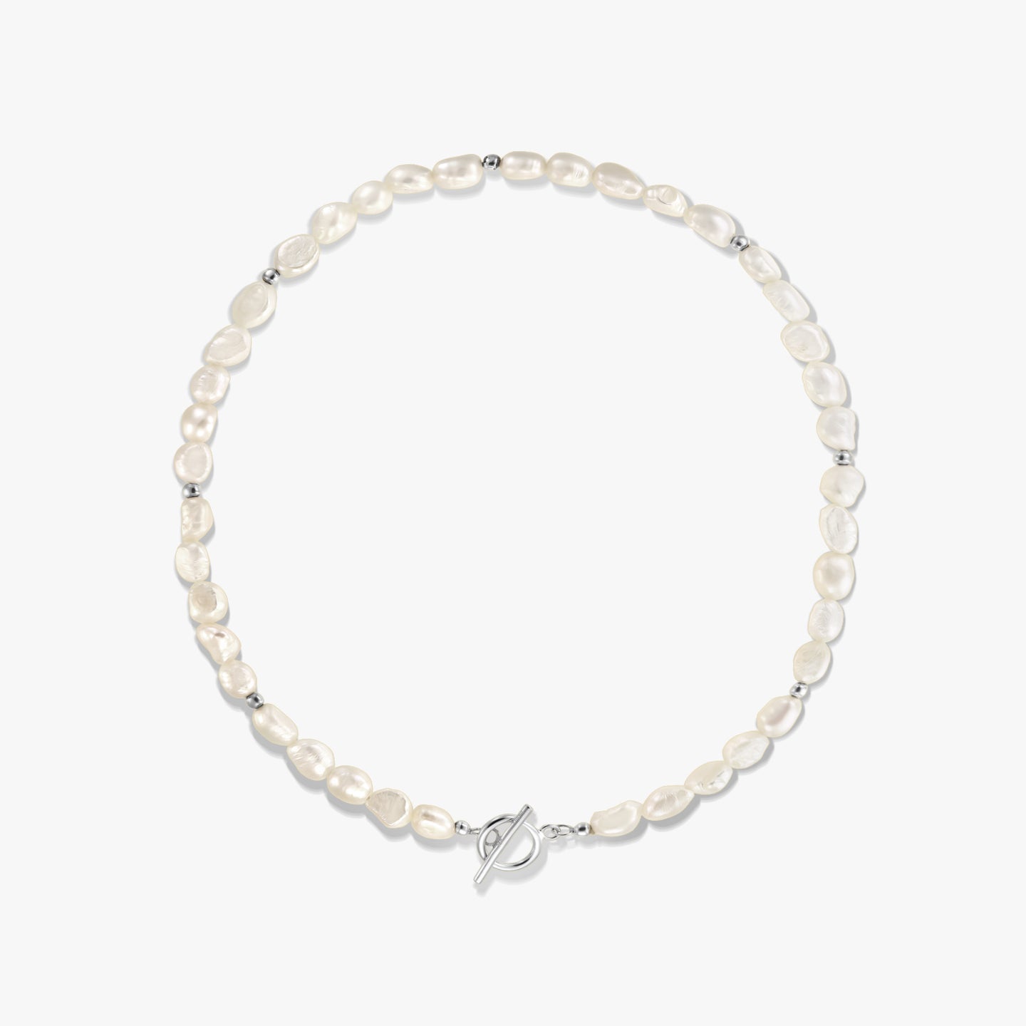 Square studio photo of a sterling silver necklace with natural freshwater pearls, small silver spacer beads, and a toggle clasp on a white background.