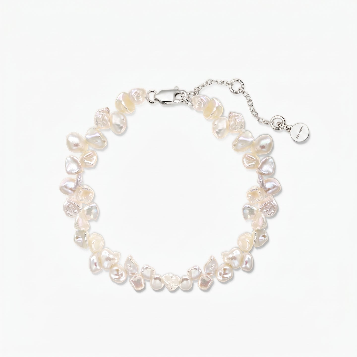 Elegant adjustable keshi freshwater pearl bracelet with a rhodium-plated 925 silver lobster clasp and extender chain on a white background.