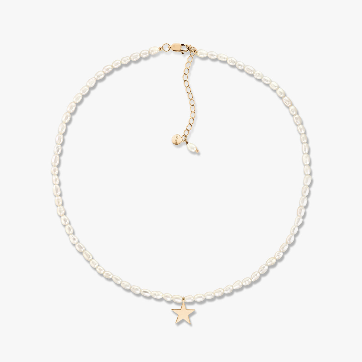 Delicate cultured pearl necklace with small gold star pendant and adjustable gold extender, displayed on a white background.