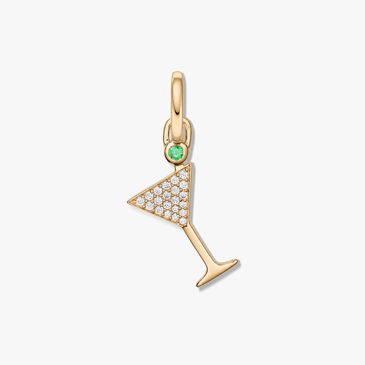 Gold-tone 925 sterling silver martini glass pendant featuring pavé clear zirconia and a small green gemstone, set against a white background.