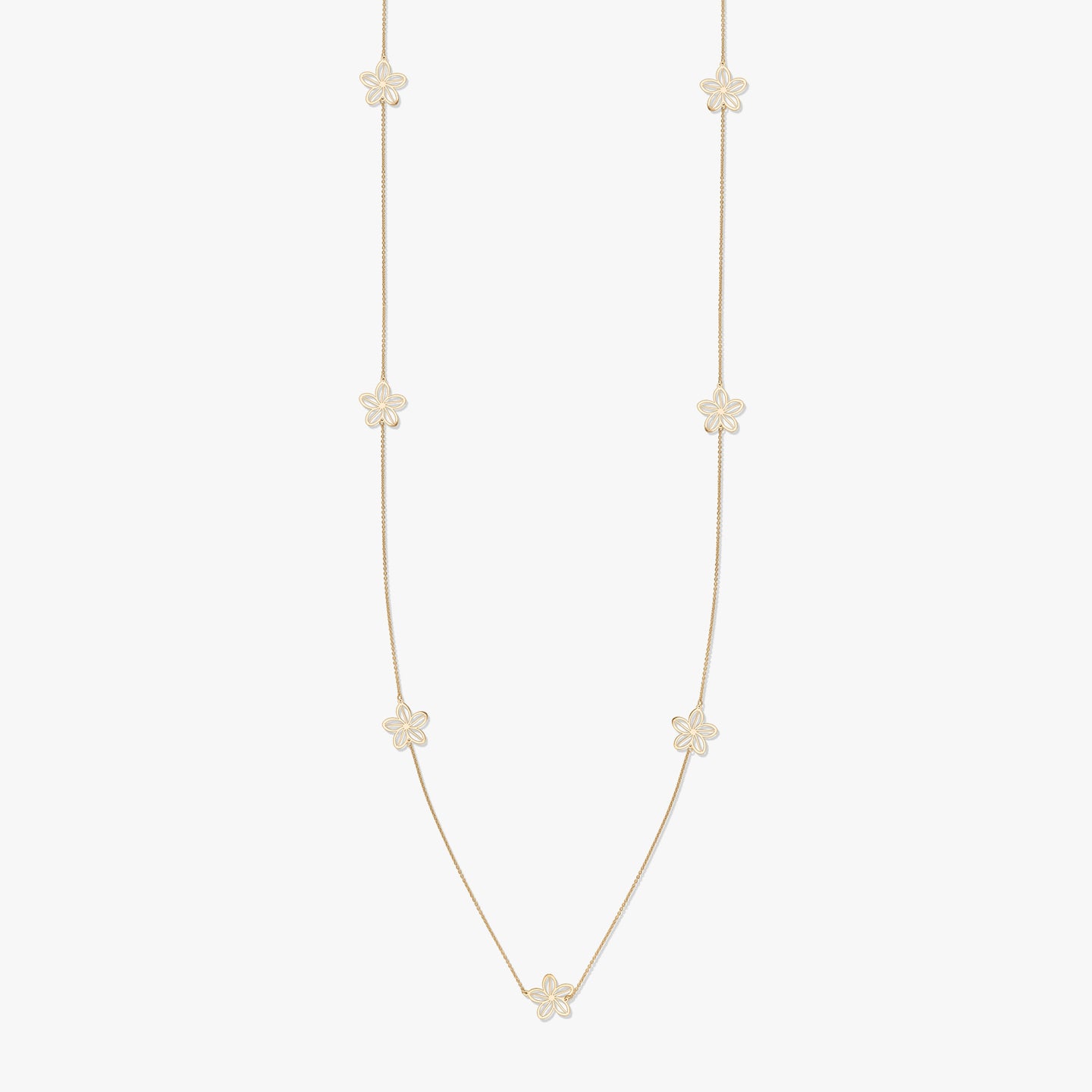 Gold necklace with floral motifs on a white background