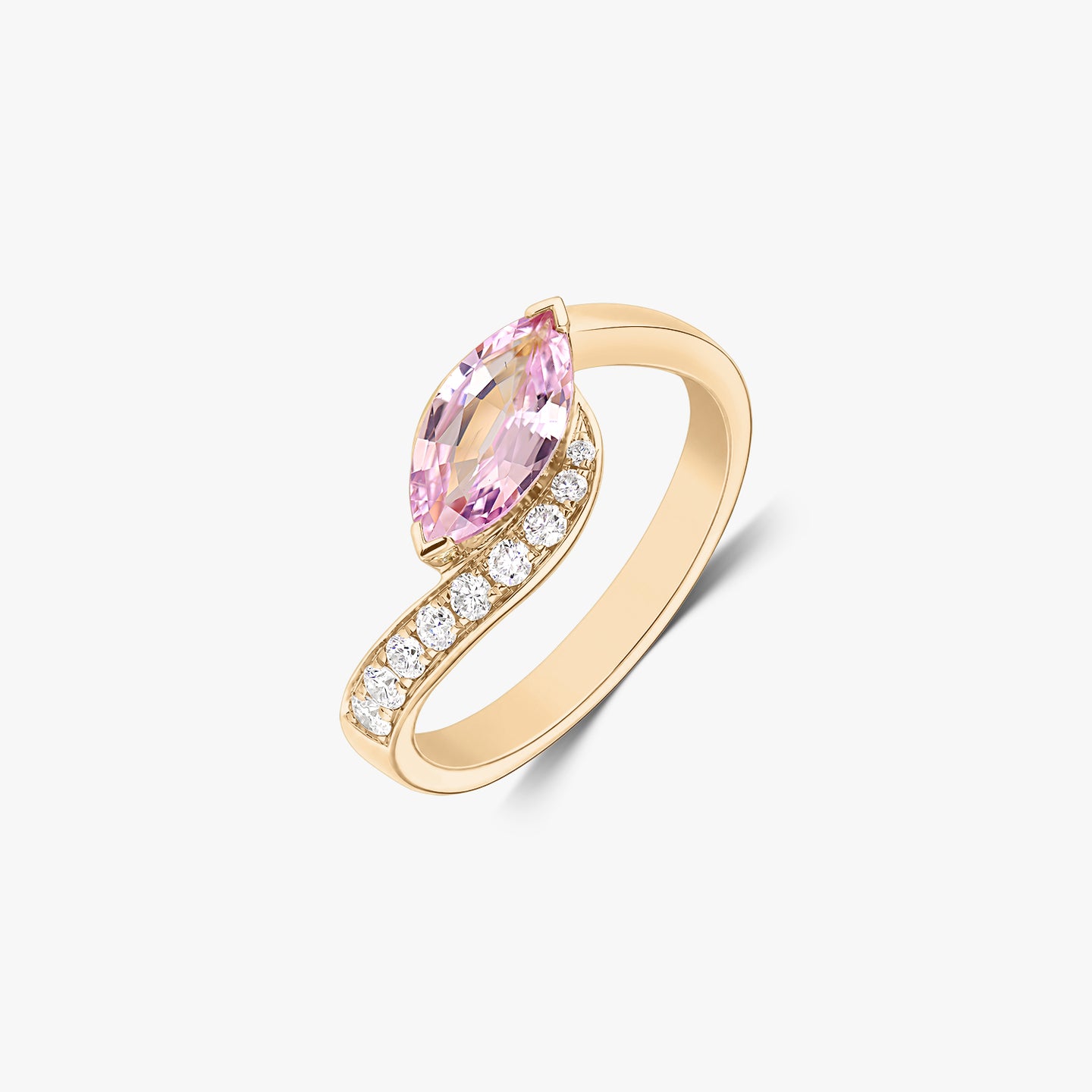 Elegant 14K yellow gold bypass ring with a marquise‑cut pink sapphire and a row of natural diamonds, isolated on a white background.