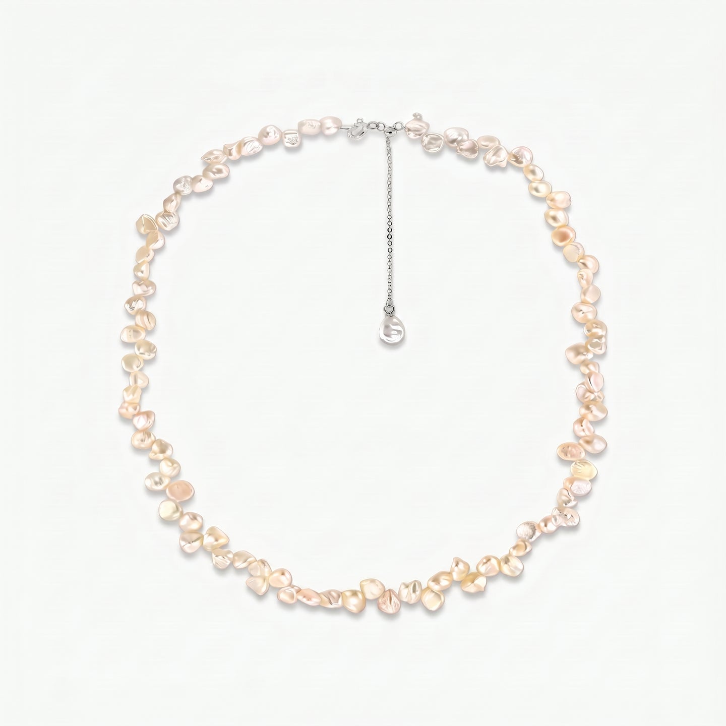 Brielle sterling silver necklace featuring pink keshi freshwater pearls and an adjustable extender chain on a white background.