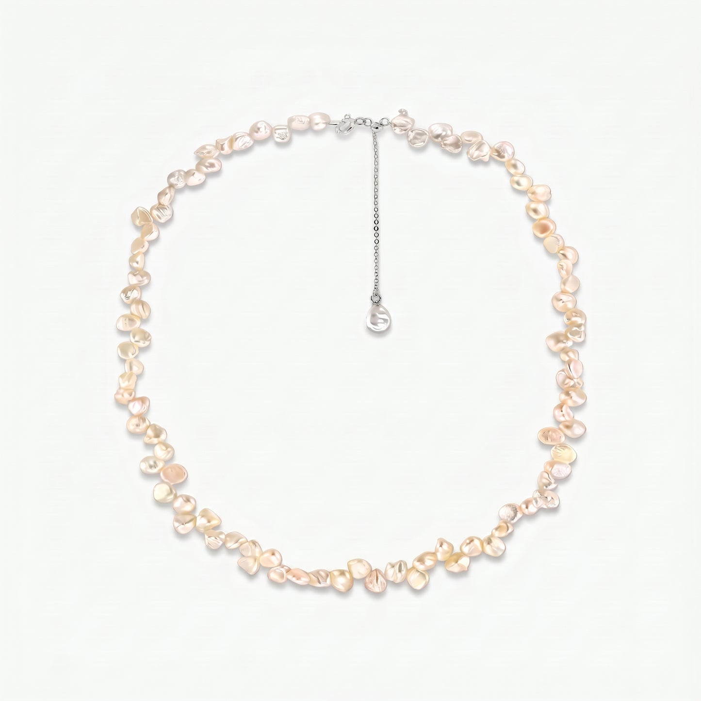Brielle sterling silver necklace featuring pink keshi freshwater pearls and an adjustable extender chain on a white background.