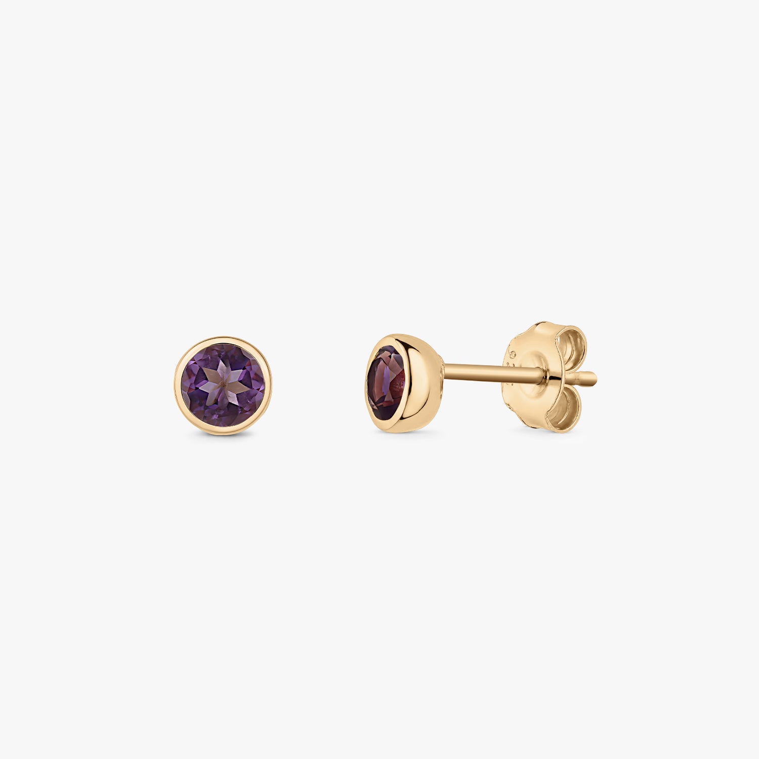 Pair of gold‑plated silver amethyst stud earrings with round bezel settings and butterfly backs on a white background.