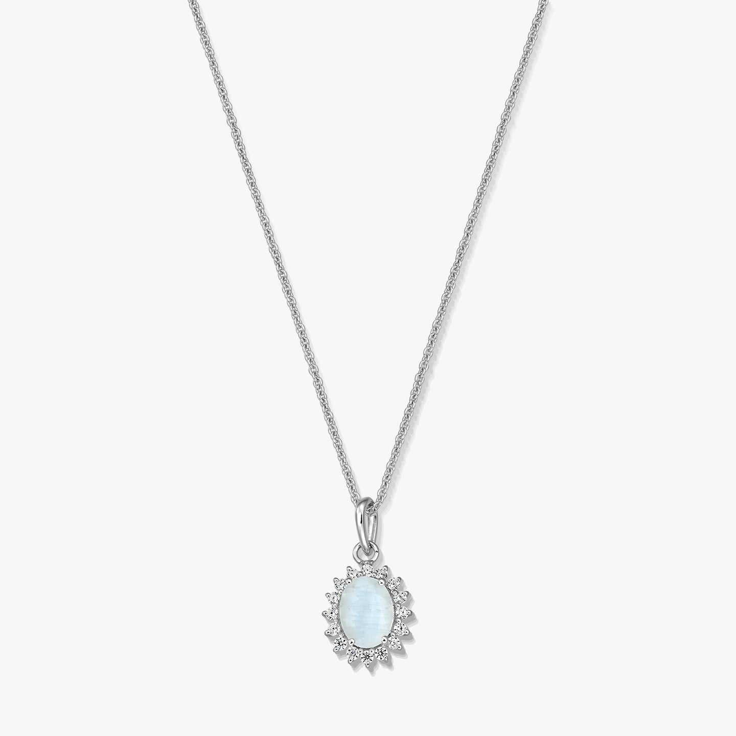 Sterling silver necklace with an oval moonstone pendant framed by a delicate halo, photographed on a white background.
