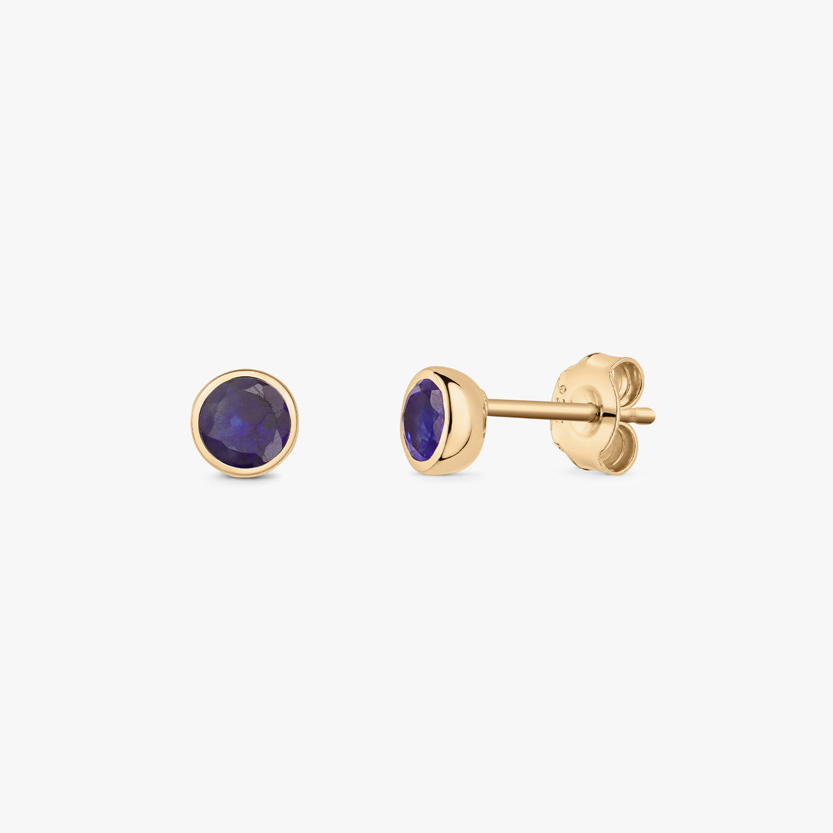 Pair of sapphire stud earrings, the September birthstone, in silver with a golden bezel setting, shown on a white background.