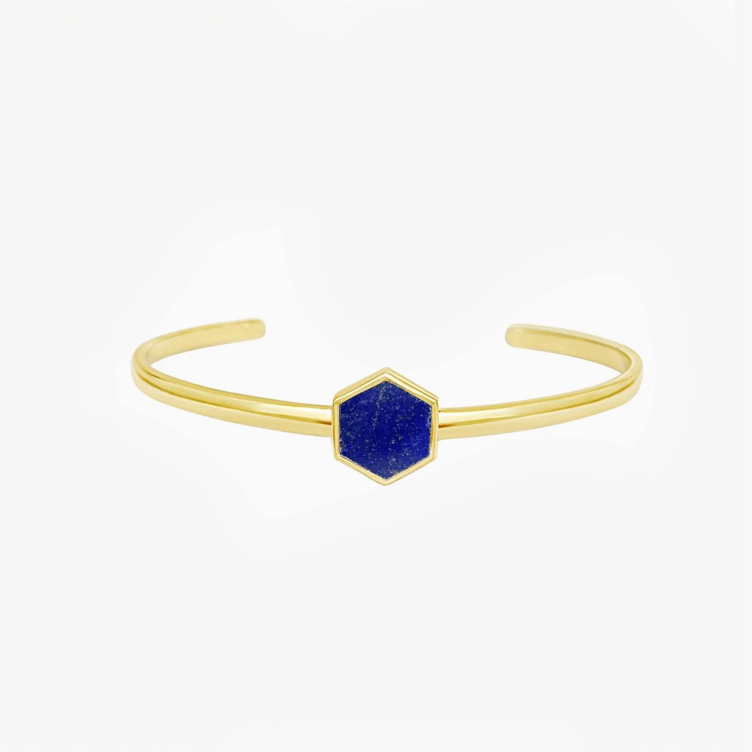 Gold-hued silver bangle bracelet with a hexagonal blue lapis lazuli stone centerpiece on a white background.