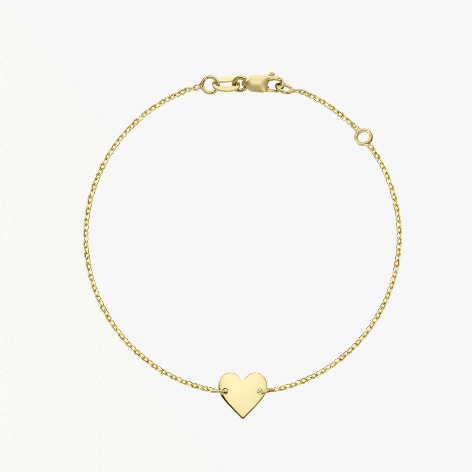 14K gold heart bracelet on a white background