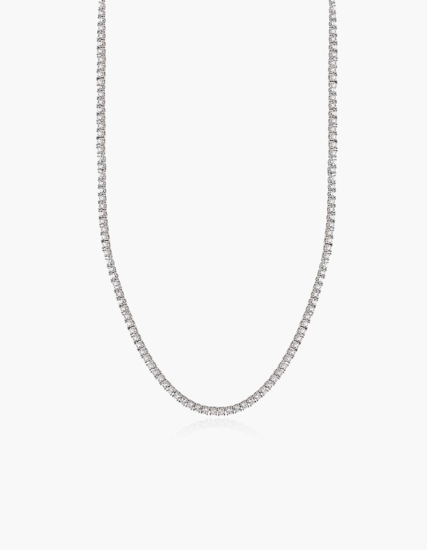 Silver tennis necklace with zirconia stones on a white background.