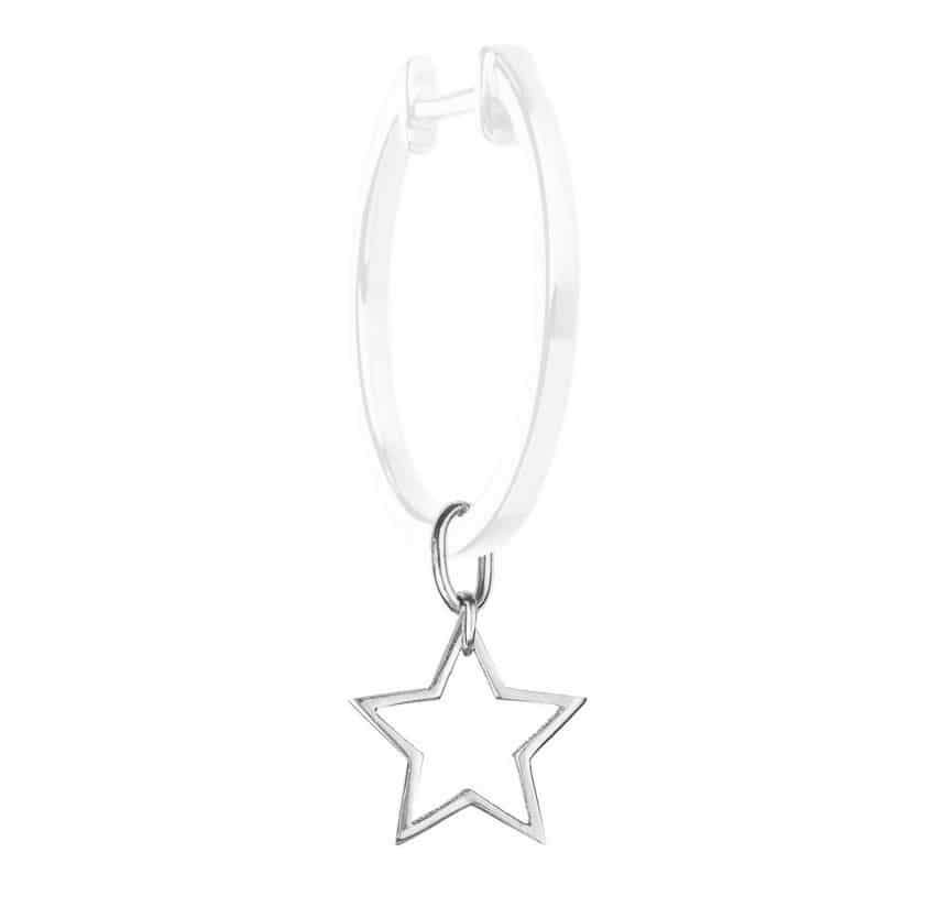 A silver hoop earring featuring a dangling star-shaped pendant.