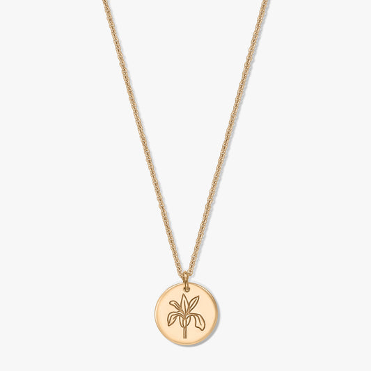 Elegant gold‑tone birthflower necklace featuring a round iris‑engraved pendant on a delicate chain, isolated on a white background.