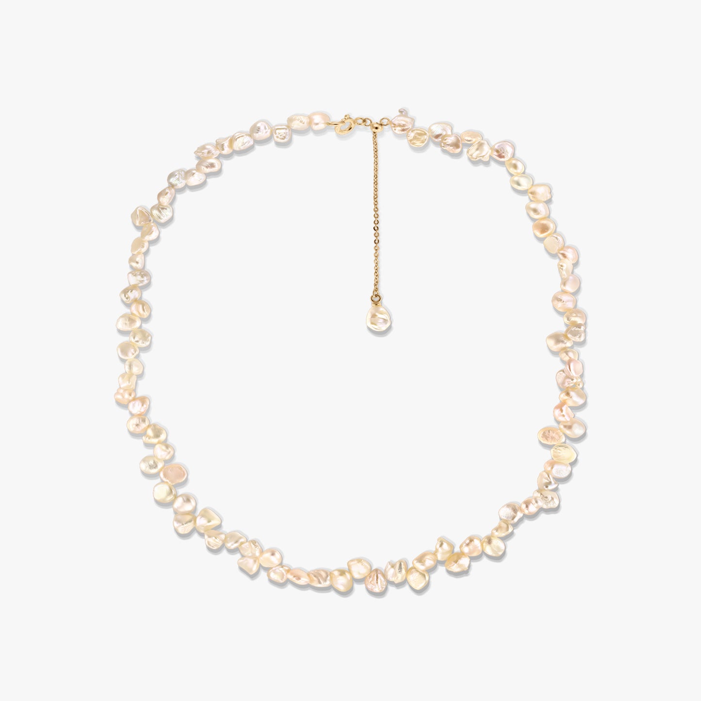 Gold-plated silver necklace featuring irregular pink keshi freshwater pearls and an adjustable chain extender, photographed on a white background.