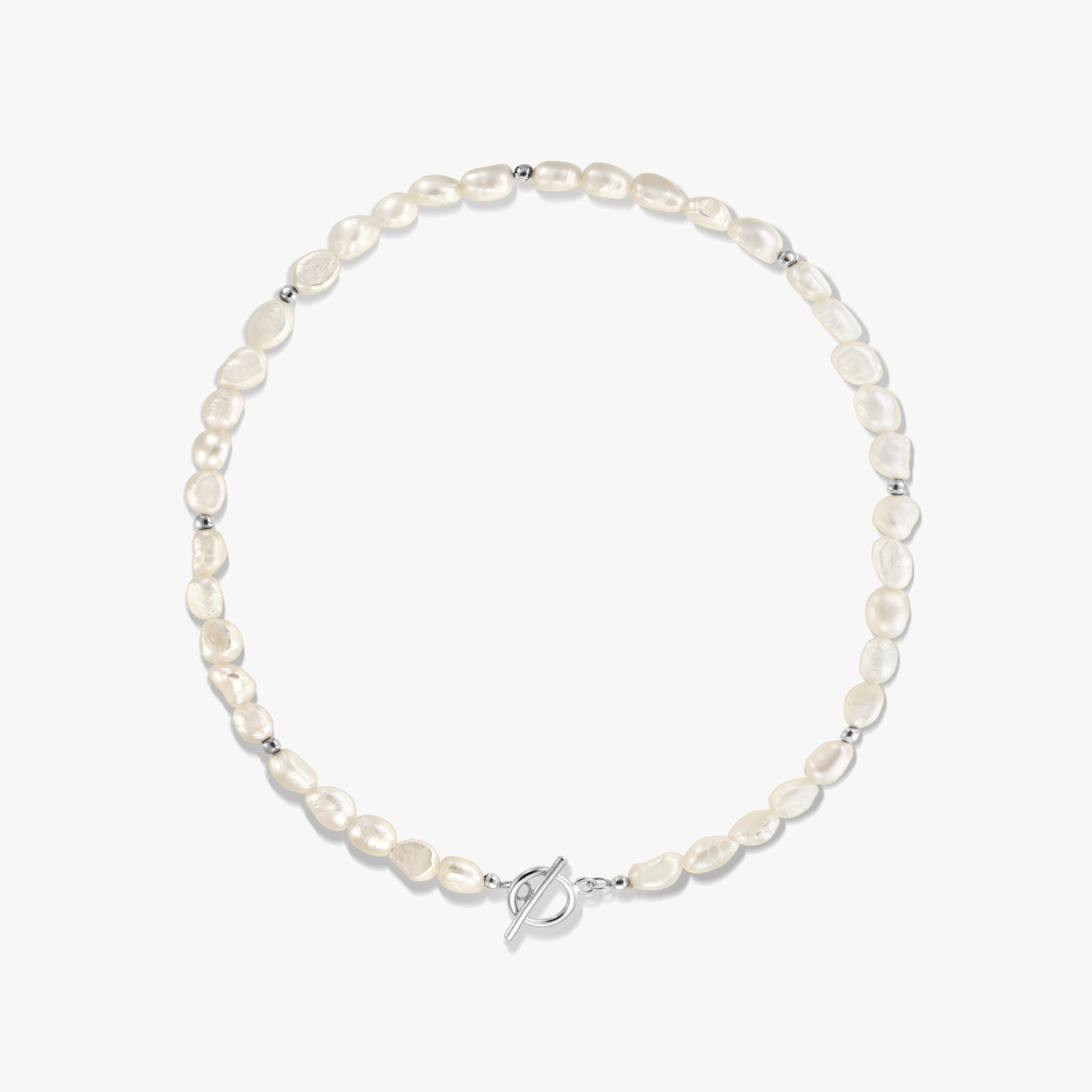 Square studio photo of a sterling silver necklace with natural freshwater pearls, small silver spacer beads, and a toggle clasp on a white background.