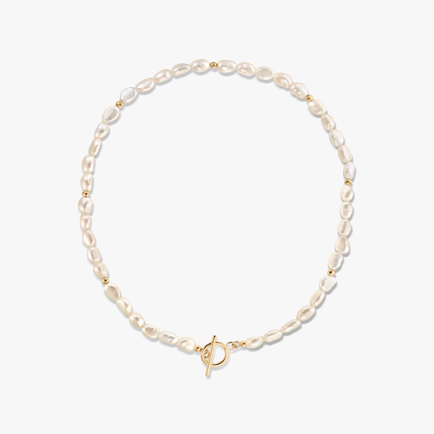 Square product photo of a dainty natural freshwater pearl necklace with small gold bead accents and a front toggle clasp on a white background.