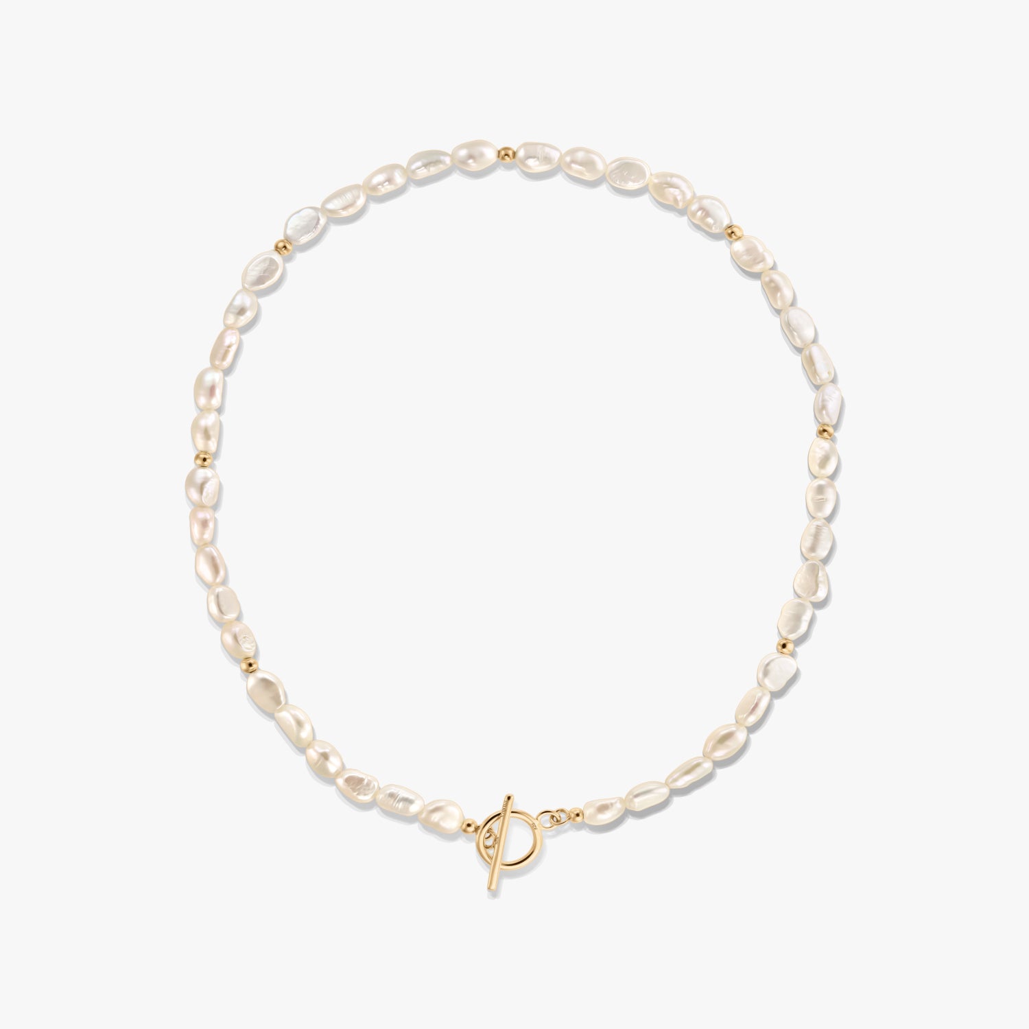 Square product photo of a dainty natural freshwater pearl necklace with small gold bead accents and a front toggle clasp on a white background.