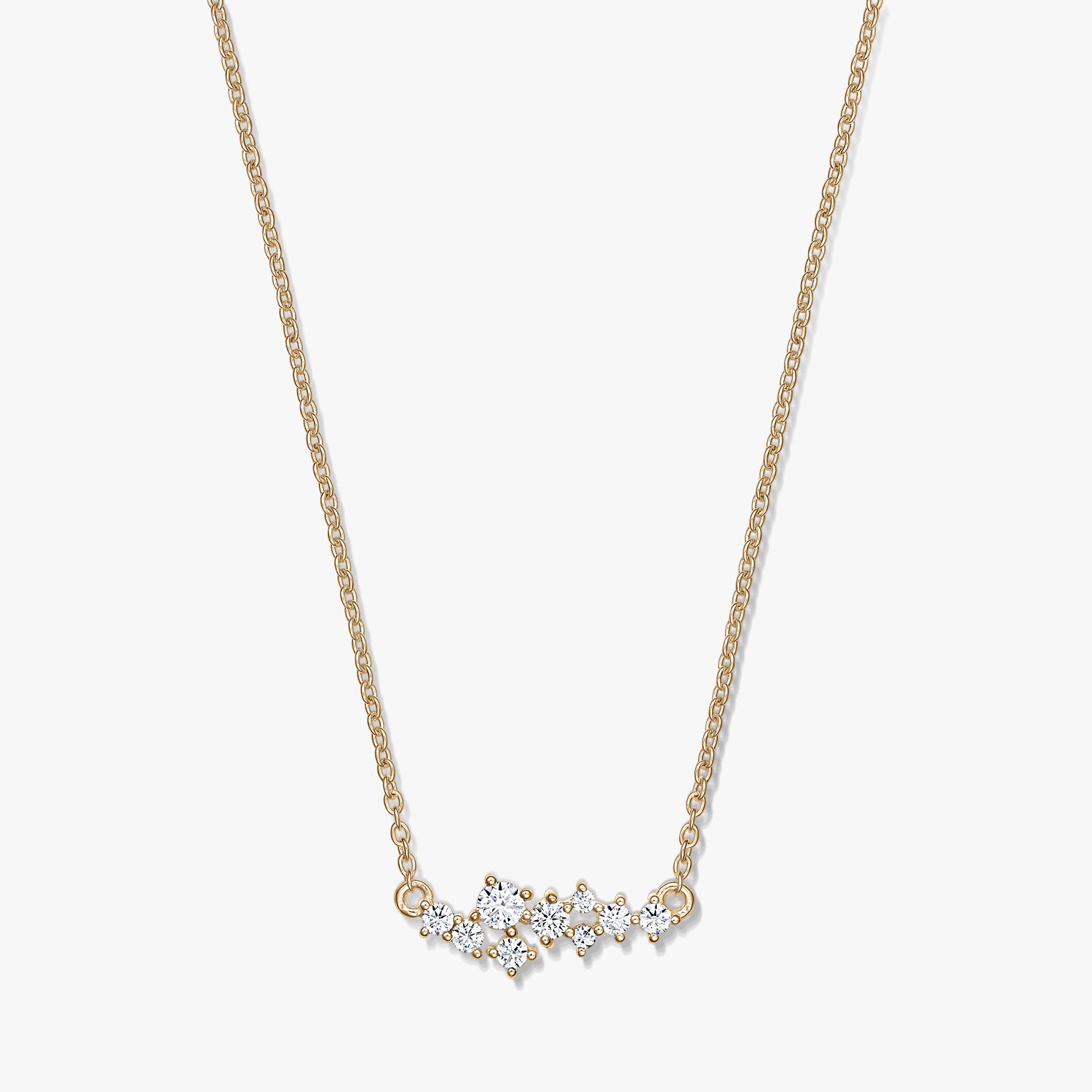 Elegant Golden Constellation silver necklace featuring a delicate chain and a starry cluster of clear stones, photographed on a white background.