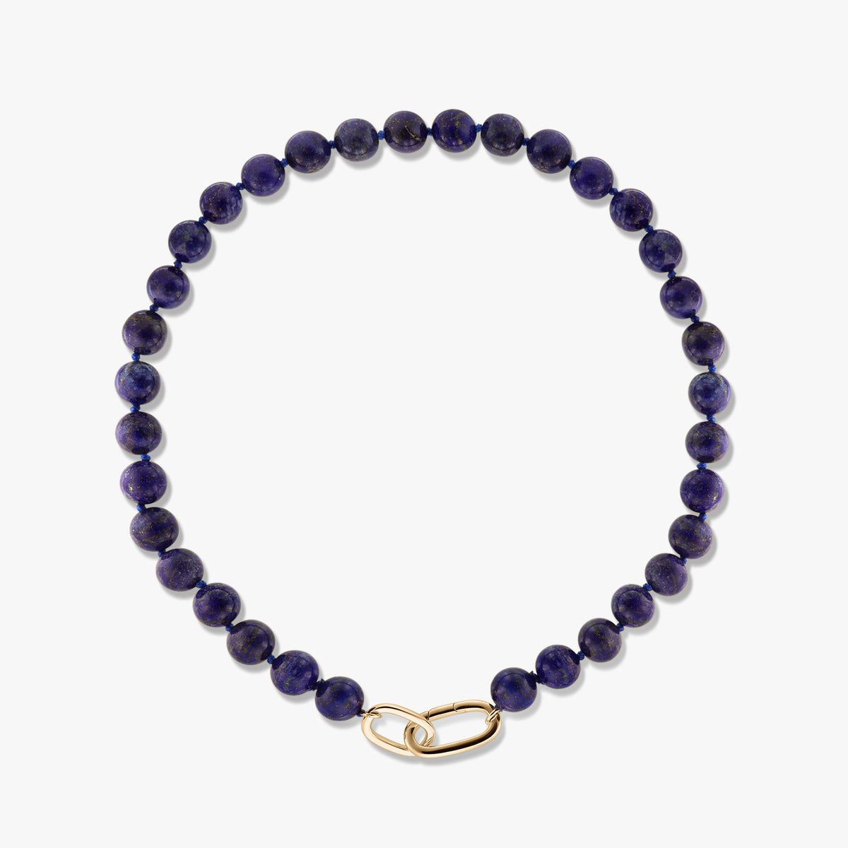 Golden Mareille silver necklace featuring round lapis lazuli beads and a gold-tone link clasp on a white background.