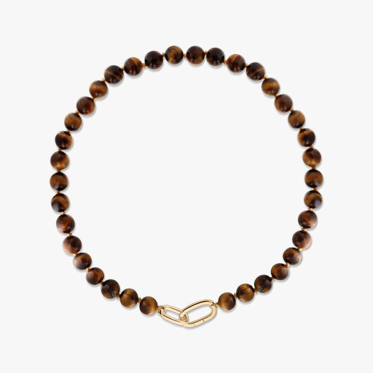 Tiger eye beaded necklace featuring polished round brown-gold stones and a gold-plated silver paperclip clasp on a white background.