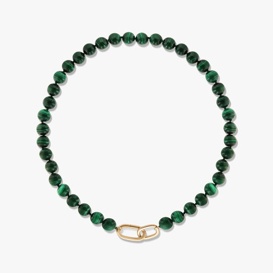 Green malachite beaded necklace with a gold-plated sterling silver paperclip clasp on a white background.