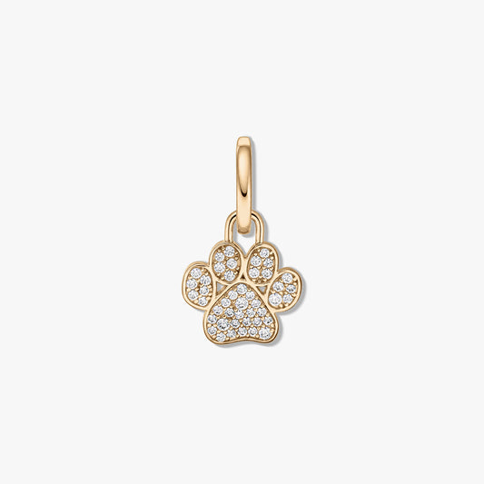 Gold-plated sterling silver paw print pendant with clear zirconia pavé on a white background.