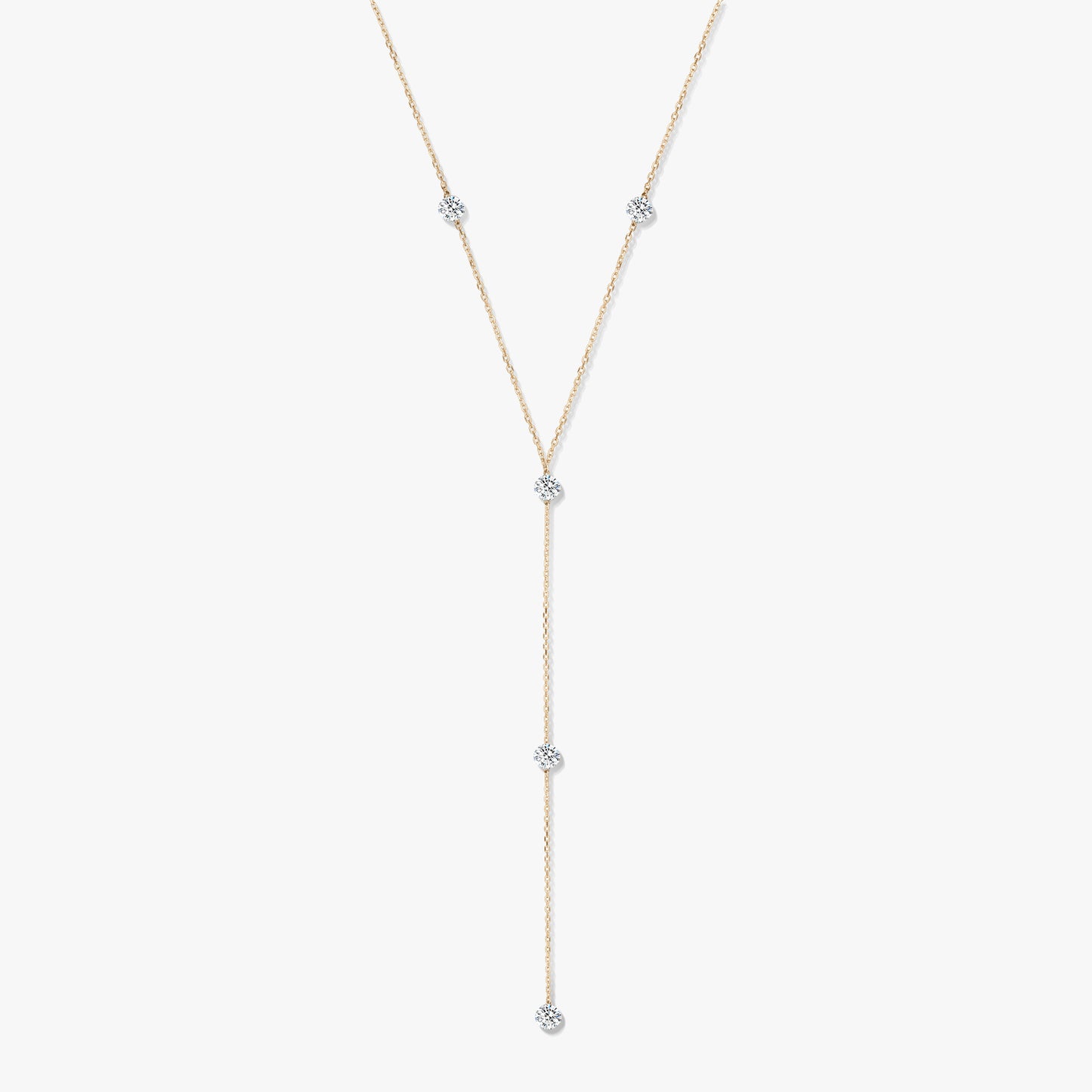 14K yellow gold diamond lariat necklace with five bezel-set round diamonds on a white background.