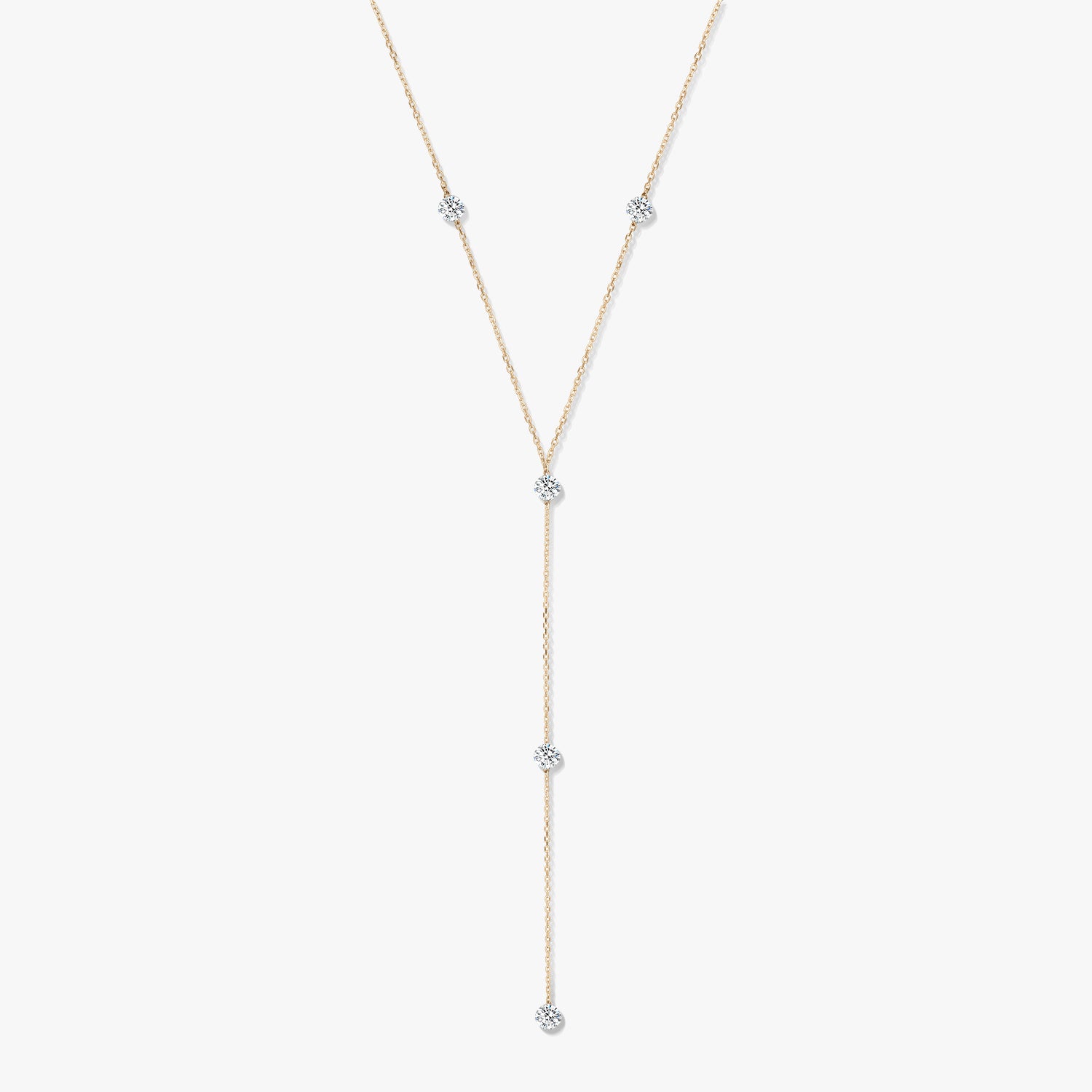 14K yellow gold diamond lariat necklace with five bezel-set round diamonds on a white background.