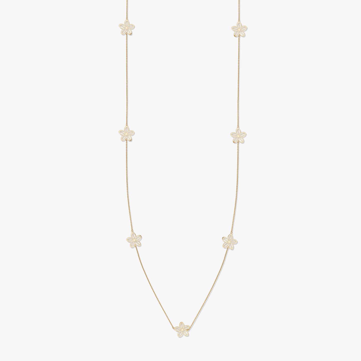 Gold necklace with floral motifs on a white background