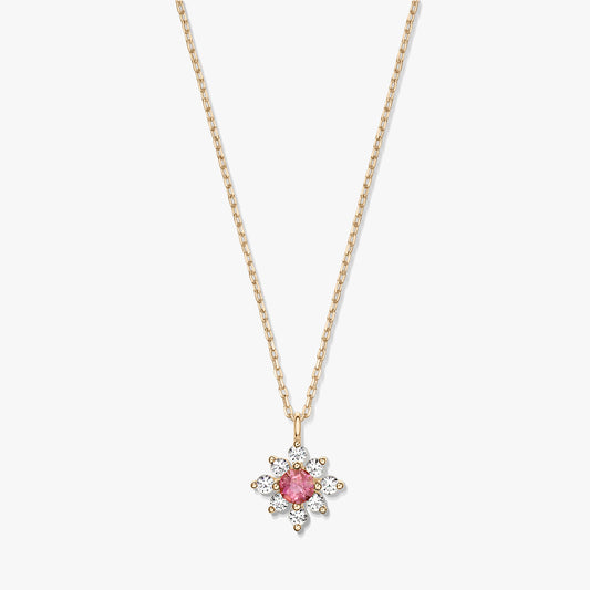 Elegant 14K gold necklace with a floral pendant featuring a pink tourmaline center haloed by white sapphires on a white background.