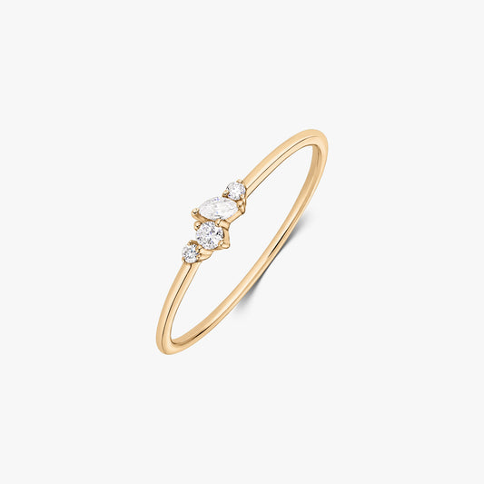 Nova 14K yellow gold ring featuring a delicate cluster of five white diamonds on a slim band, shown on a white background.