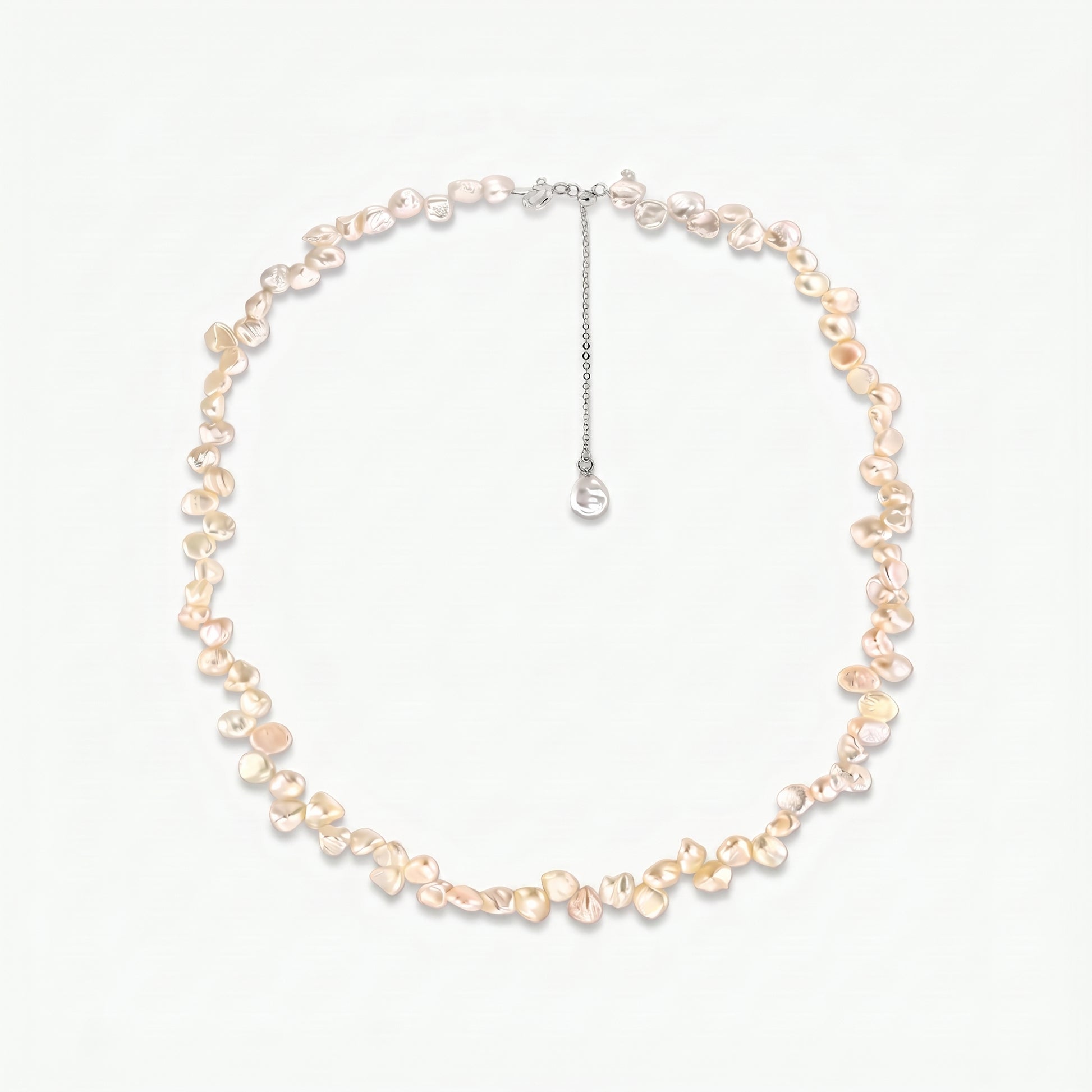 Brielle sterling silver necklace featuring pink keshi freshwater pearls and an adjustable extender chain on a white background.