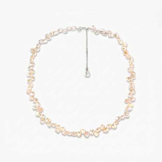 Brielle sterling silver necklace featuring pink keshi freshwater pearls and an adjustable extender chain on a white background.