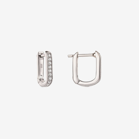 Pair of sterling silver U-shaped huggie hoop earrings with clear zirconia pavé, one shown open to display the hinged clasp, isolated on a white background.