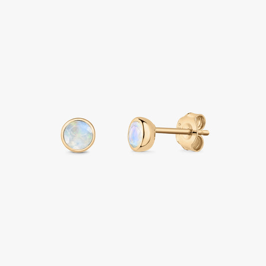 Elegant round moonstone stud earrings in gold-plated sterling silver, shown front and side with butterfly backs on a white background.