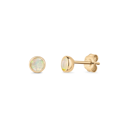 Pair of gold-plated sterling silver stud earrings with bezel-set round opals, displayed front and side view on a transparent background.