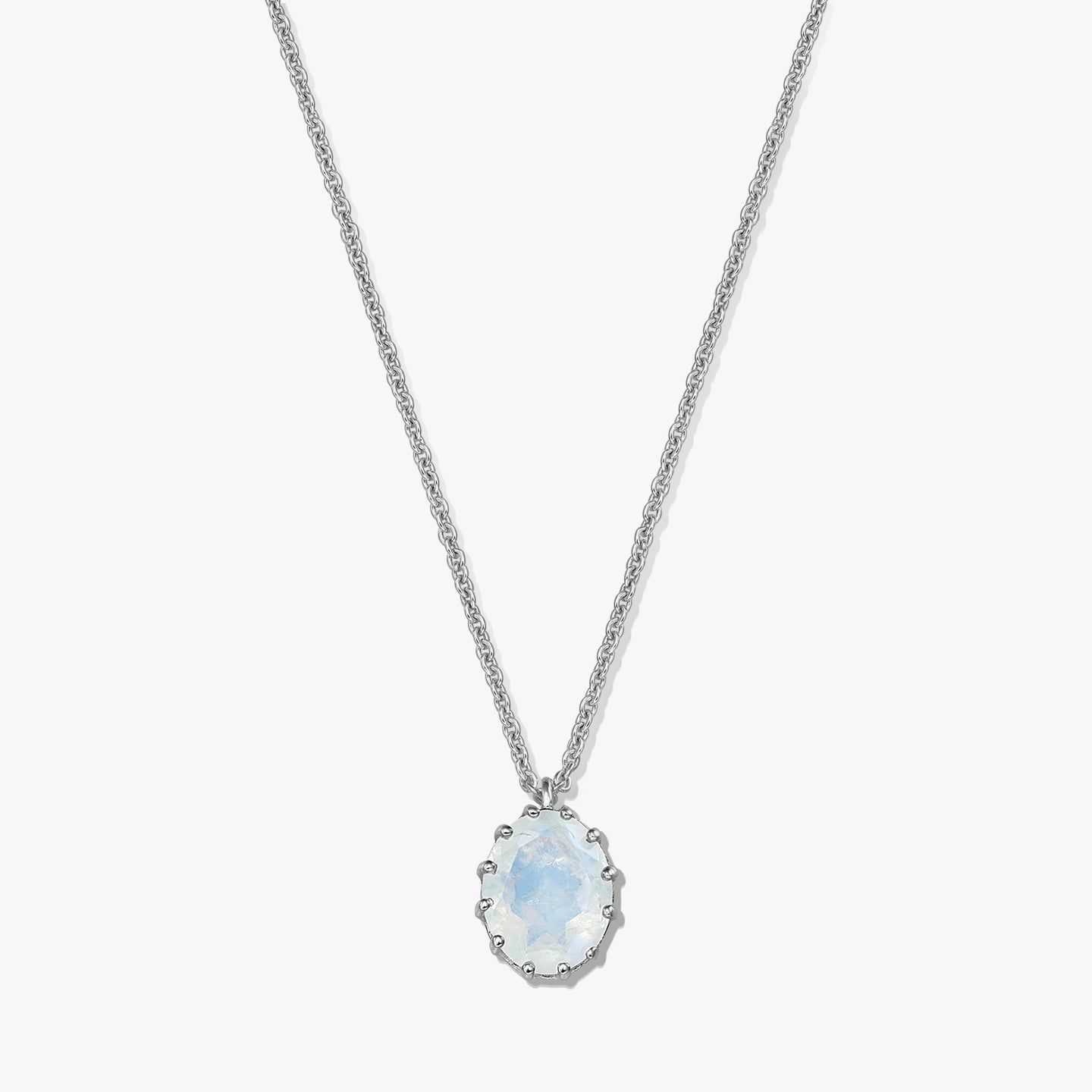 Sterling silver necklace with an oval moonstone pendant on a white background.