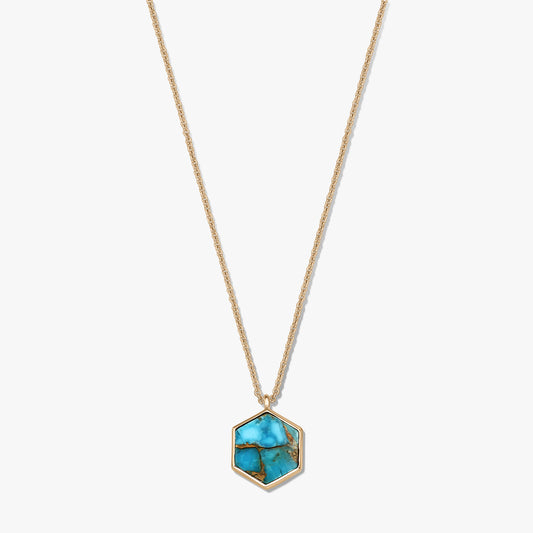 Elegant gold-plated sterling silver necklace with a hexagonal turquoise-blue copper pendant on a white background.