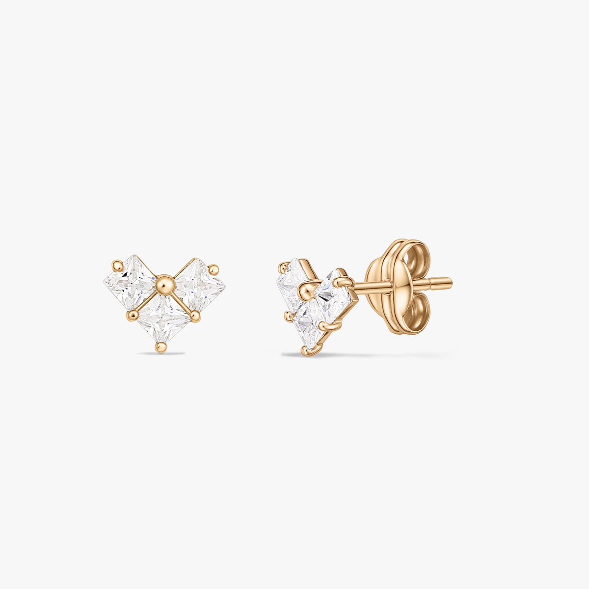 Pair of yellow gold stud earrings with three square clear stones forming a small heart-shaped cluster, displayed on a white background.