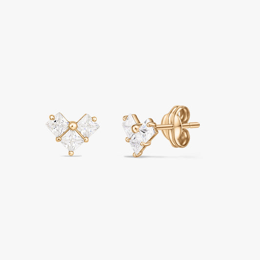 Pair of yellow gold stud earrings with three square clear stones forming a small heart-shaped cluster, displayed on a white background.