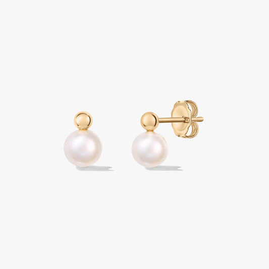 Elegant cultured pearl stud earrings with silver posts and butterfly backs on a white background.