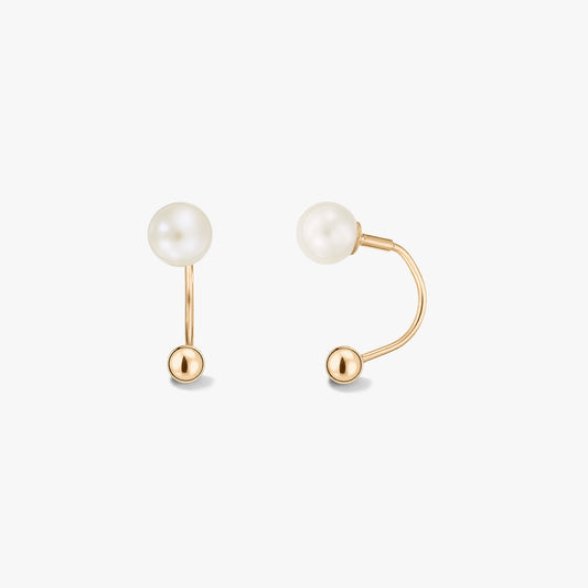 Pair of 14k yellow gold ear-jacket earrings with natural white pearls on a solid white background, shown from the front and side to display the curved back bar.