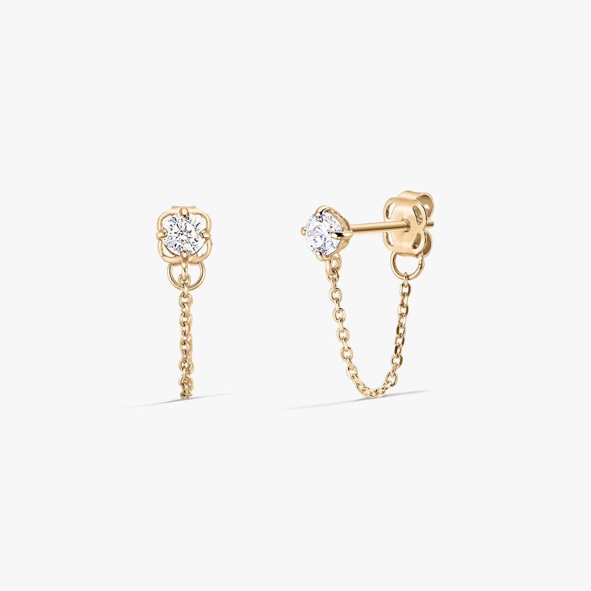 Pair of Emma gold stud earrings with clear zirconia stones and delicate chain drops, displayed front and side on a white background.