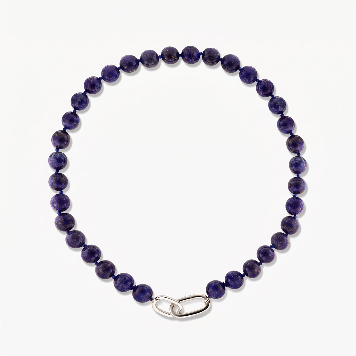 Square studio photo of the Mareille silver necklace with round lapis lazuli beads and a polished silver link clasp on a white background.
