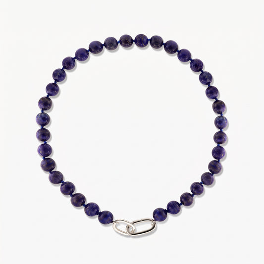 Square studio photo of the Mareille silver necklace with round lapis lazuli beads and a polished silver link clasp on a white background.