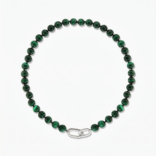 Malachite bead necklace with a silver paperclip clasp, photographed on a white background.